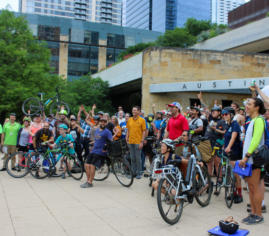 Large group of cyclists in front of Austin City All on Bike to Work Day.
